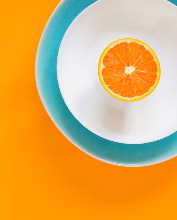 White egg on yellow background