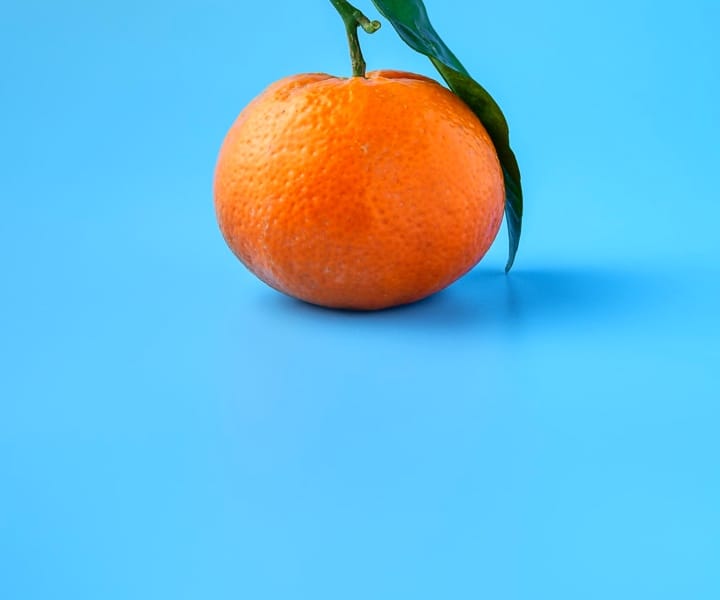 White egg on yellow background